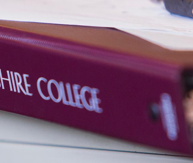 Hampshire College binder with papers