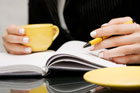 student studying with a cup of coffee