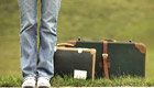 student with suitcase