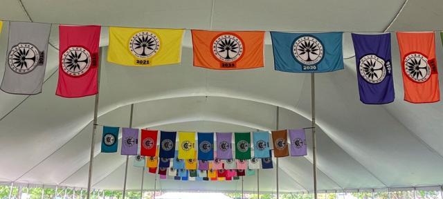 Commencement flags hung inside the Commencement tent