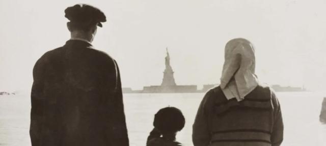 immigrants facing the Statue of Liberty from afar