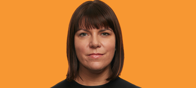 Amanda Dennis's face on an orange background.