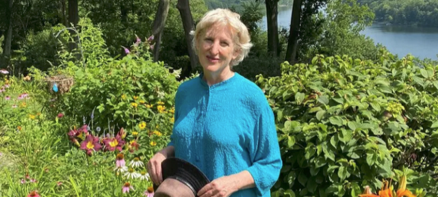 Ellen Bernstein standing in her garden