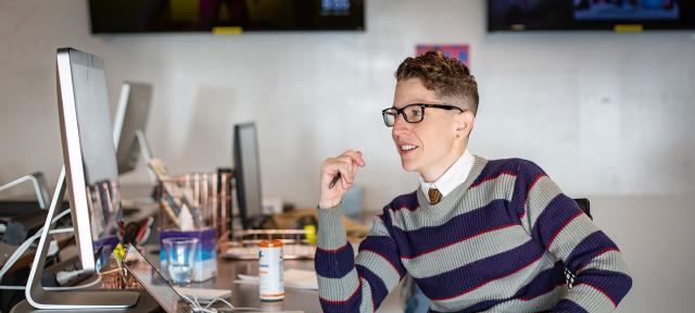 Kate Sosin at their desk