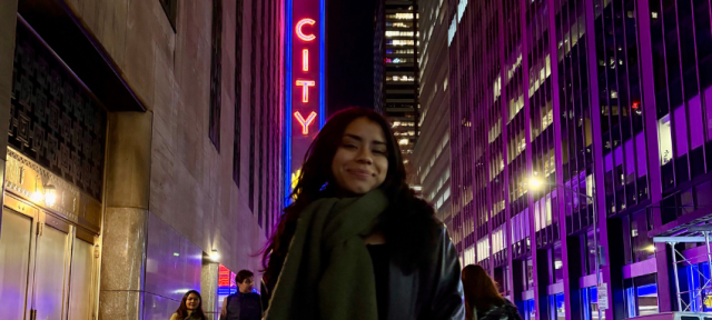 Student Jazlyn Cabrera F24 stands outside in the city.