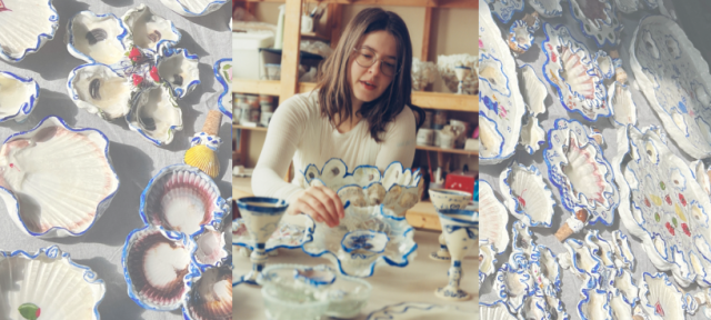 A person in classes and a white shirt painting a ceramic item with a background of colorful ceramic dishes.