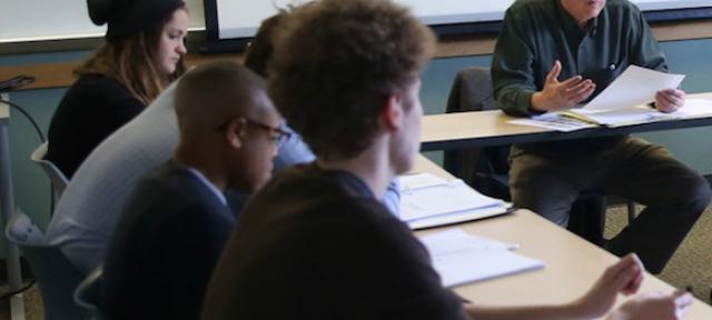 Robert Meagher in classroom with students