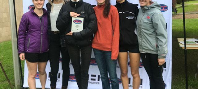 Women's Cross Country winners stand with awards