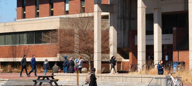 Students outside the library on a spring day March 2019