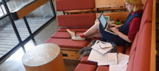 student in Hampshire College library