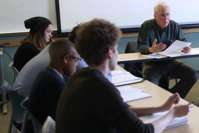 Robert Meagher in classroom with students