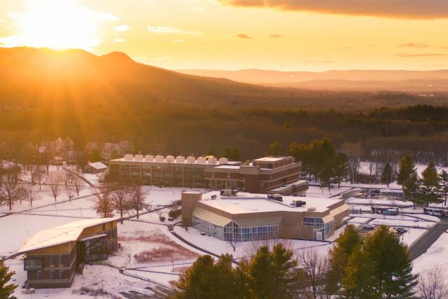 aerial view of campus with snowy sunset