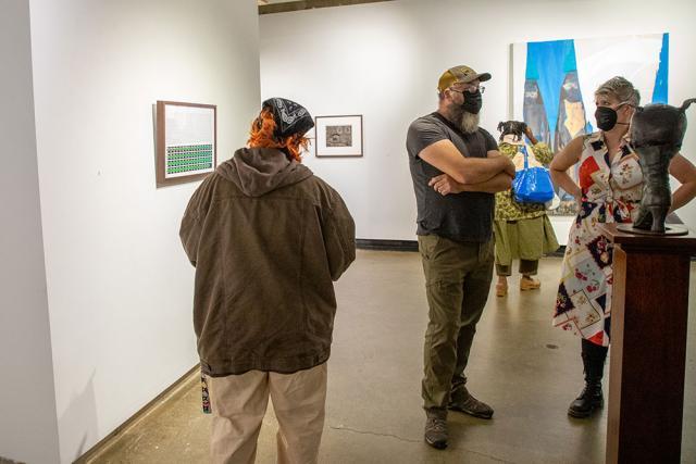 Guests mingle in the gallery