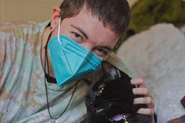 Student Graham and their cat Clancey