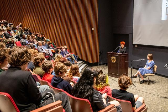 Margaret Cerulo and Zooey Zephyr in the Main Lecture Hall of Franklin Patterson Hall