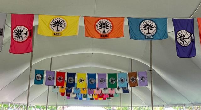 Commencement flags hung inside the Commencement tent