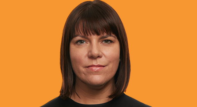 Amanda Dennis's face on an orange background.