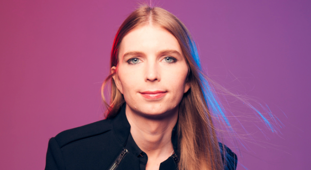 Headshot of Chelsea E. Manning with a pink and purple background.