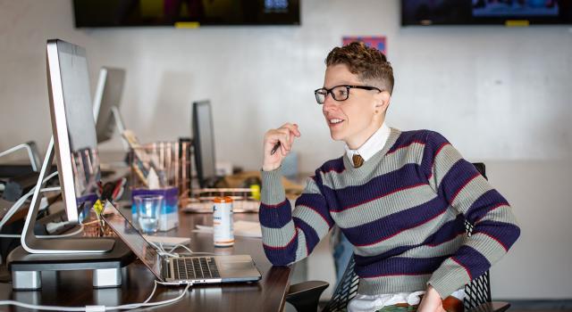 Kate Sosin at their desk