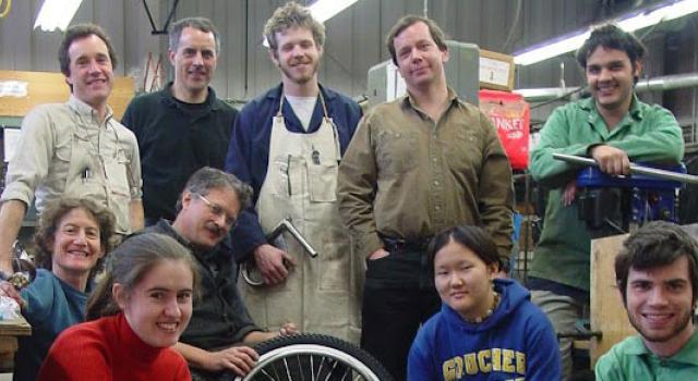 Students and teachers in the Center for Design smiling at the camera