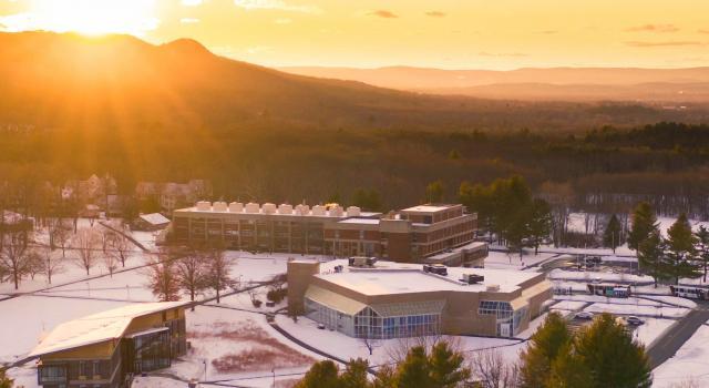 aerial view of campus with snowy sunset