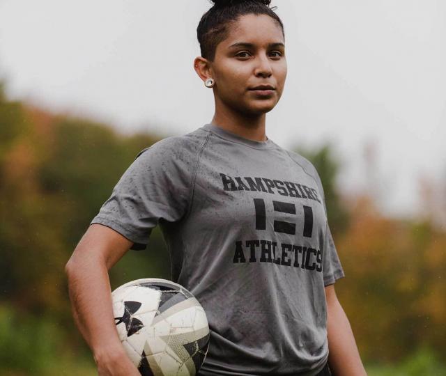 Soccer player holding ball