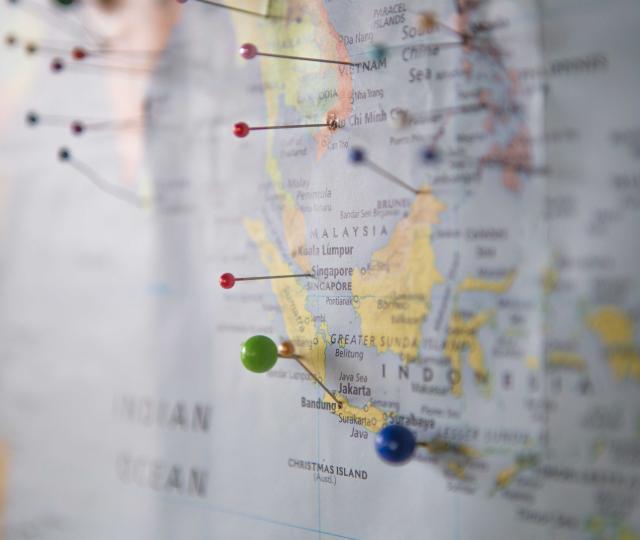 Wall map with pins in it.