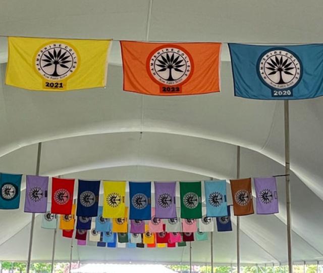 Commencement flags hung inside the Commencement tent