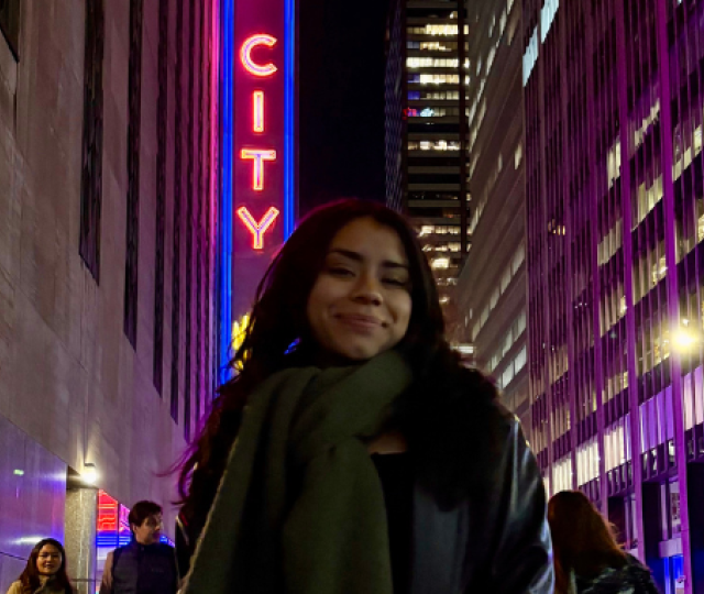 Student Jazlyn Cabrera F24 stands outside in the city.