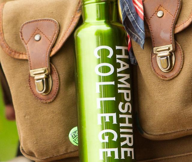 Student carrying Hampshire College water bottle