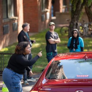 Someone directing a car