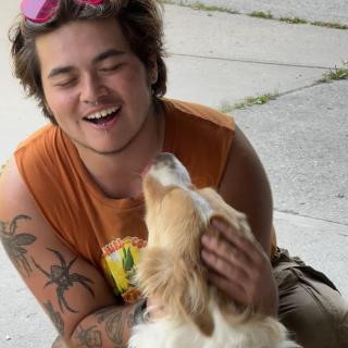 Person smiling with dog