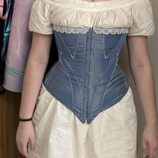 Lila in chemise, drawers, and corset all made during her second semester at Hampshire.