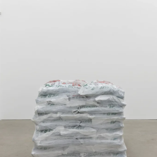 Bags stacked in installation by Anthony Discenza