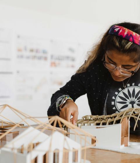 Student working on building model.