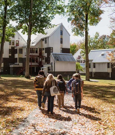 Students walking in the fall on campus.