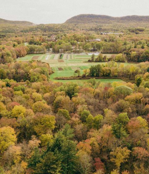 Drone shot of the mountains and campus.