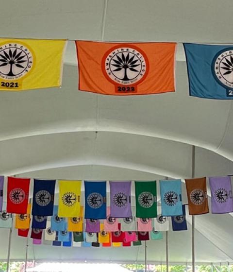Commencement flags hung inside the Commencement tent