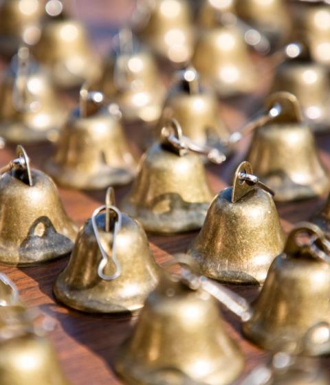 Small bells sitting on a table.