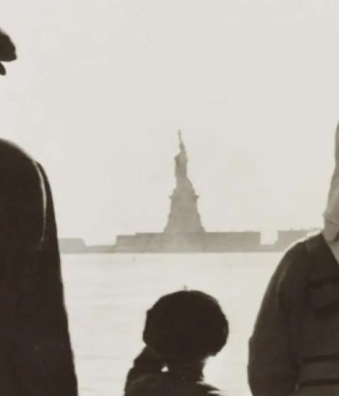 immigrants facing the Statue of Liberty from afar 