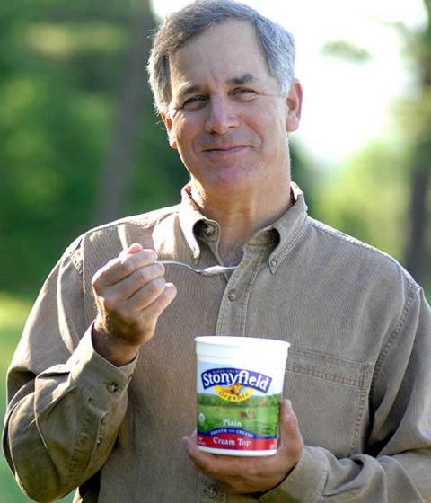 Gary Hirshberg in field with yogurt