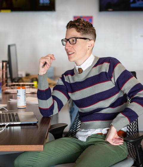 Kate Sosin at their desk