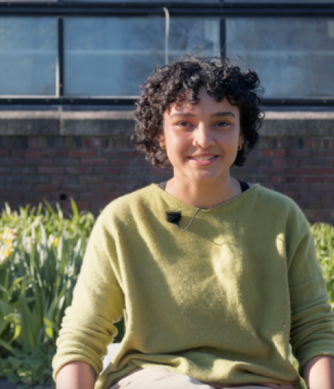 On the left: A photo of Nadja in a green sweater. On the right: A photo of Nadja holding her work.