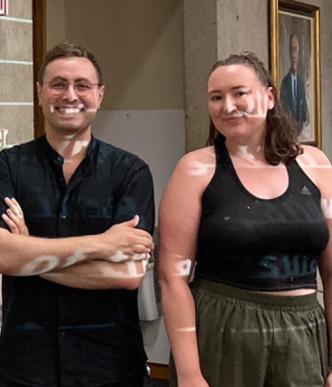 Lorenzo Conte and Kat Brown in front of their installation