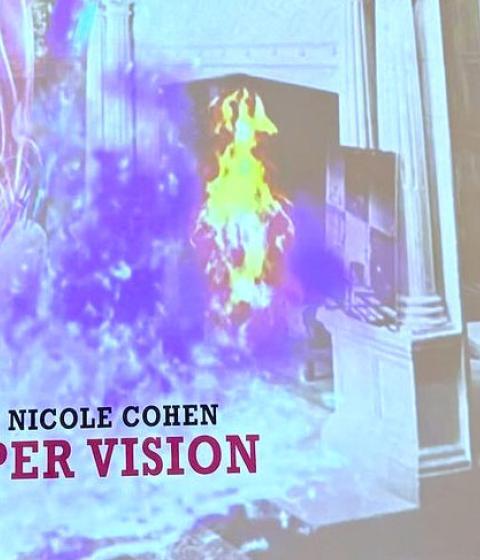 Nicole Cohen and Karen Levitov with Super Vision banner