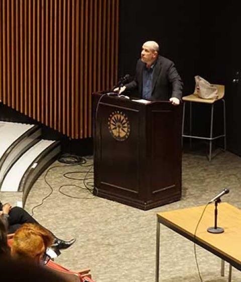 Jeff Sharlet addressing an audience in Franklin Patterson Hall
