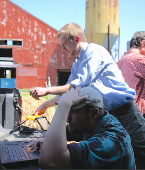 Hampshire College Student Josh Minot at work on his Agrigatr project