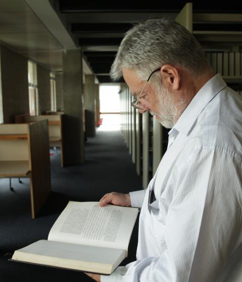 Bob McCarthy reading his Div III in the Library