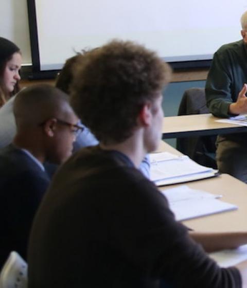 Robert Meagher in classroom with students