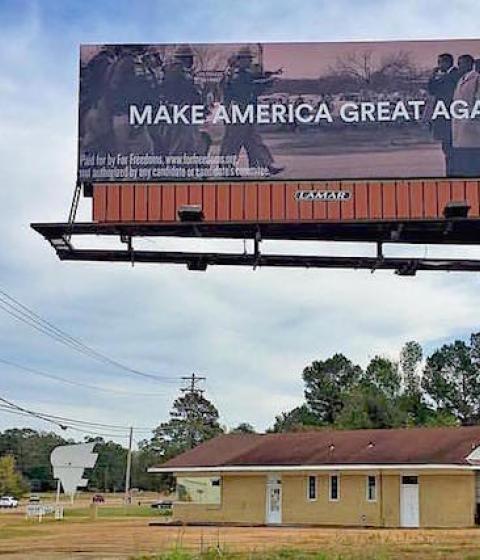 MAKE AMERICA GREAT AGAIN. Photo of Bloody Sunday in 1965 Alabama by Spider Martin. A political-art billboard by Wyatt Gallery and For Freedoms